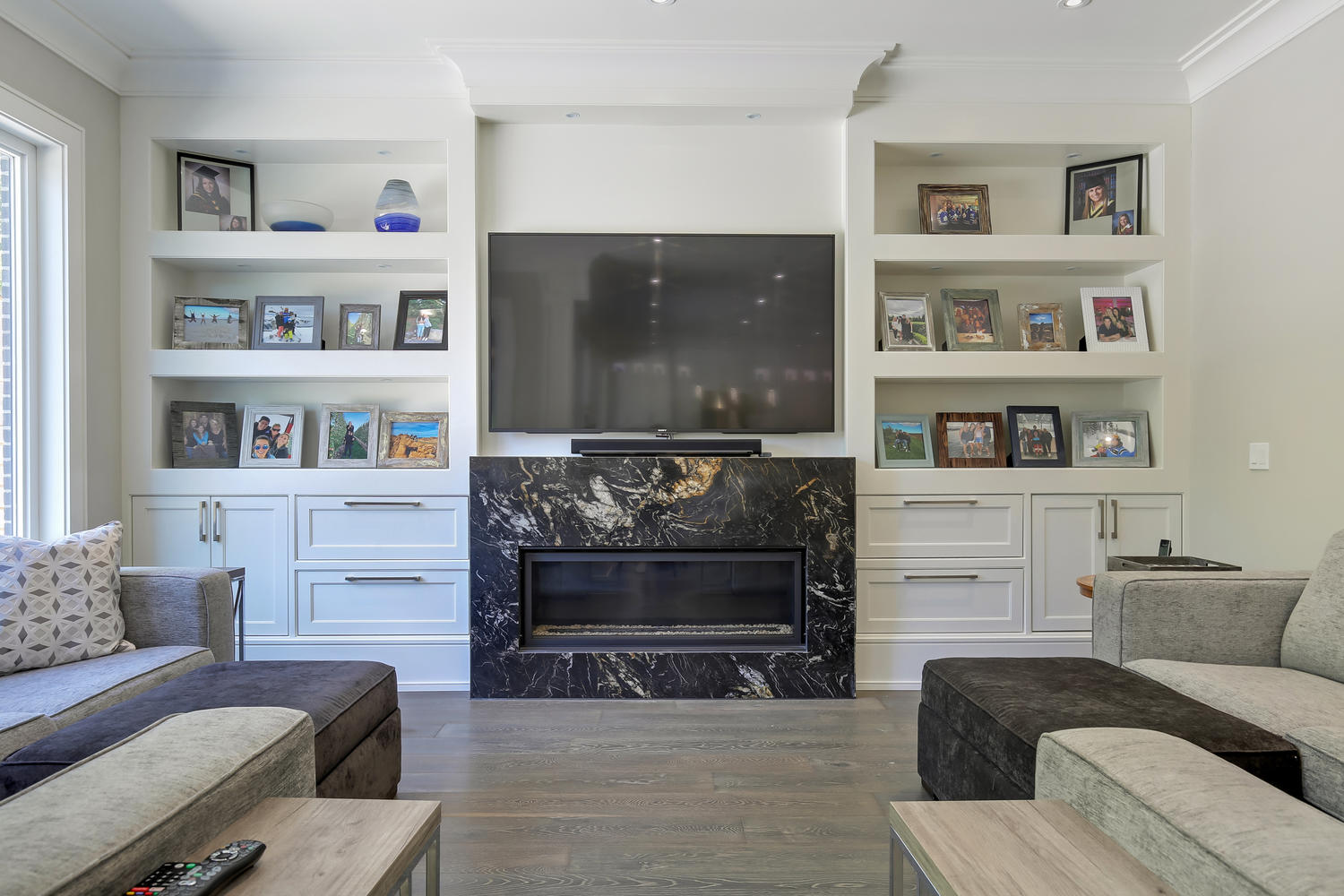 view of a fireplace and a LED TV above it
