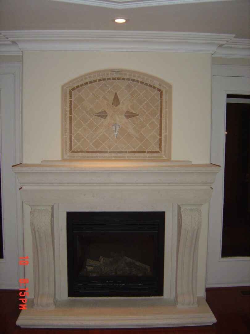 A Fireplace With a Design on the Mantle