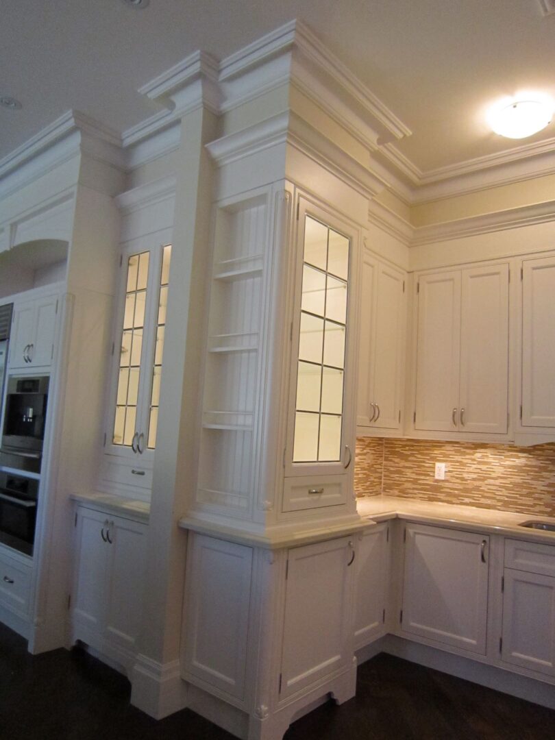 A White Color Counter With a Light in a Kitchen