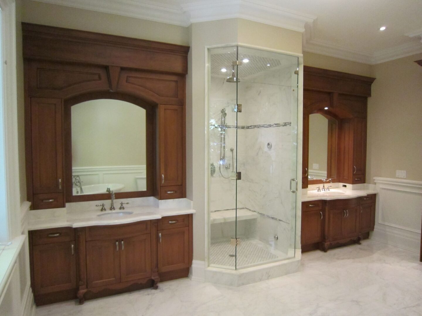 A Glass Door Shower With Two Sinks Side by Side