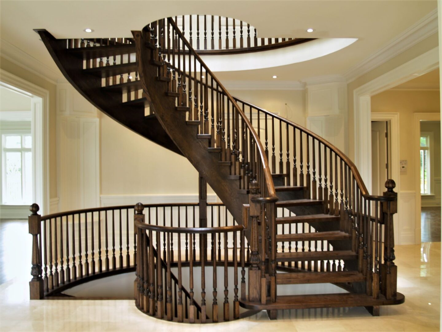 A Wooden Spiral Staircase Landing Image