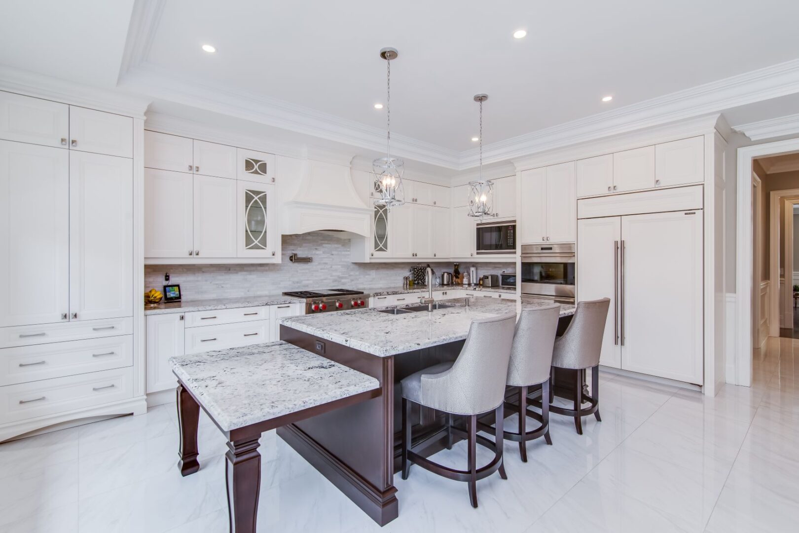 a kitchen space with a marble island