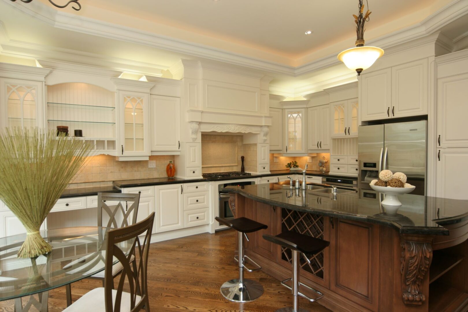 A Kitchen Island With Revolving Bar Stools