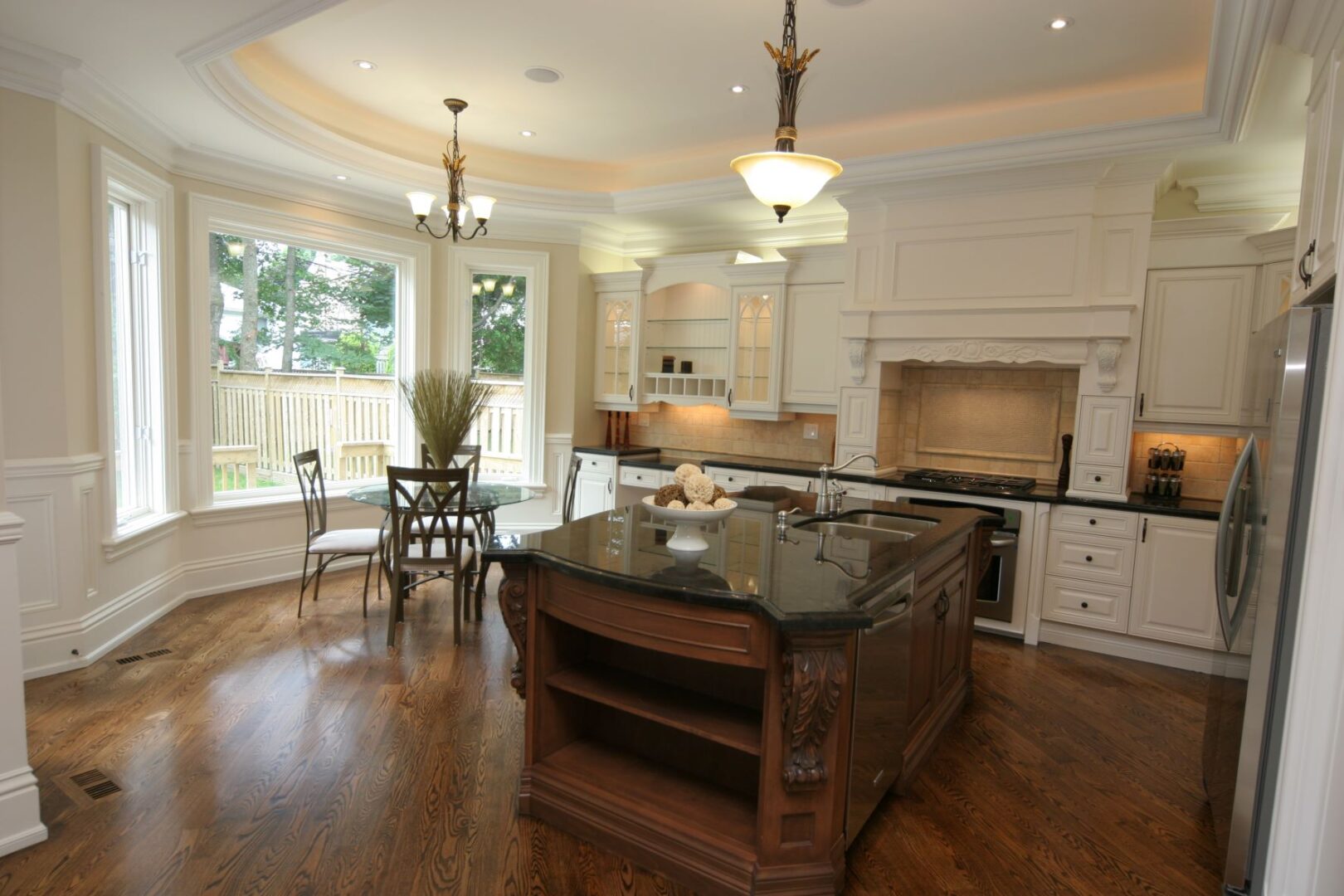 An Island With Granite Counter With a Design