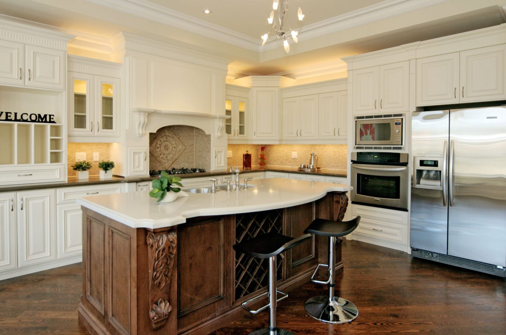 A Kitchen Island With White Marble Counter