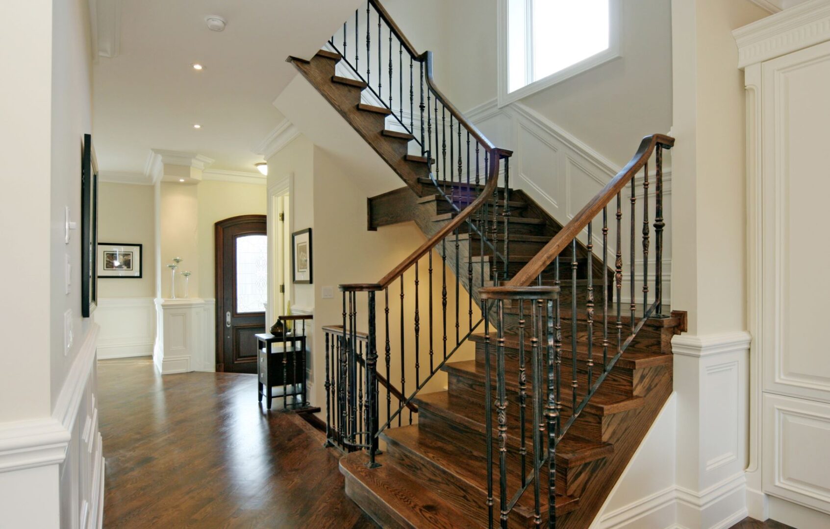 A Metallic Railing of a Stair With Wooden Railing