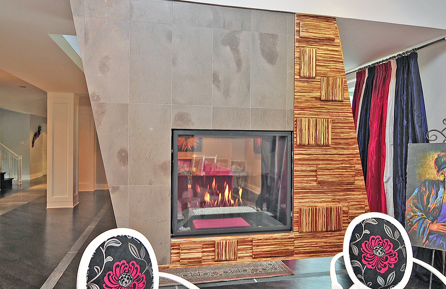 A Fireplace With Wood and Tile Surface